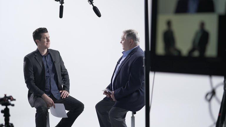 Shawn Livermore and Chad Collins discussing AI implementation architecture and deployment strategy in studio